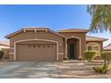 Charming single-story home with well-manicured landscaping and a two-car garage at 13153 W Cottontail Ln, Peoria, AZ 85383
