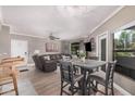 Open-concept living and dining area featuring a comfortable leather sofa and modern decor at 15095 N Thompson Peak Pkwy # 1005, Scottsdale, AZ 85260