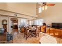 Dining room featuring a table, chairs, and decor with neutral walls at 15211 N 89Th Ave, Peoria, AZ 85381