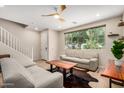 Bright living room featuring neutral tones, tile floors, and natural light at 1825 E Hampton Ln # 108, Gilbert, AZ 85295
