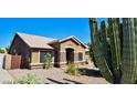 Beautiful desert home featuring stone accents and desert landscaping at 1849 S 96Th St, Mesa, AZ 85209
