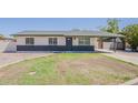 Charming single-story home with brick accents and a covered carport, set on a well-maintained lot at 2130 W Cindy St, Chandler, AZ 85224