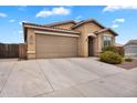 Lovely home with a two-car garage and desert landscaping, perfect for low-maintenance living at 2264 W Arroyo Way, San Tan Valley, AZ 85144