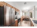 Bright kitchen featuring stainless steel appliances and a cozy breakfast nook with ample natural light at 29151 N Lilly Ln, San Tan Valley, AZ 85143