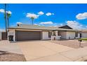 Wide driveway leading to a home with minimalist landscaping, perfect for easy upkeep at 3008 S Saguaro Cir, Mesa, AZ 85202