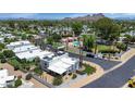 Breathtaking aerial view of a desert home showcasing its solar panels and proximity to a community pool at 34 E Boca Raton Rd, Phoenix, AZ 85022