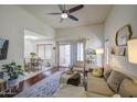Inviting living room with ceiling fan, sleek hardwood floors, and a comfy sofa, creating a relaxing space at 3600 N Hayden Rd # 2310, Scottsdale, AZ 85251