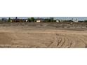 Picture of a vacant dirt lot waiting to be developed and built on in a growing community at 37459 W Missouri Ave, Tonopah, AZ 85354