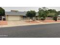 Charming single-story home featuring a well-maintained lawn and a spacious two-car garage at 4329 W Bloomfield Rd, Glendale, AZ 85304
