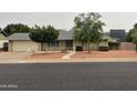 Charming single-story home featuring a well-maintained lawn and a spacious two-car garage at 4329 W Bloomfield Rd, Glendale, AZ 85304