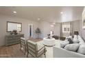 Open-concept living room with stylish furniture, a large rug, and plenty of natural light at 5132 N 83Rd St, Scottsdale, AZ 85250