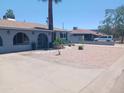 Well-maintained single-story home with desert landscaping and mature trees at 5539 N 31St Ln, Phoenix, AZ 85017