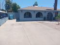 Charming single-story home with a spacious driveway and unique arched facade at 5539 N 31St Ln, Phoenix, AZ 85017