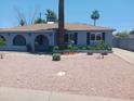 Lovely single-story home with desert landscaping, including plants and decorative rocks at 5539 N 31St Ln, Phoenix, AZ 85017