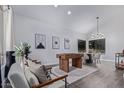 Bright living room with foosball table and modern decor and dining table at 6449 E Paradise Ln, Scottsdale, AZ 85254