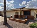 A charming single-story home with a front porch, two-car garage, and nicely landscaped front yard at 8255 E Kiva Ave # 430, Mesa, AZ 85209