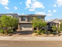 Beautiful two-story home with a two car garage and well maintained front yard landscaping at 8754 W San Juan Ave, Glendale, AZ 85305