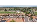 Beautiful home in golf community showcasing meticulous landscaping at 9263 W Oraibi Dr, Peoria, AZ 85382
