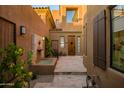 Picturesque courtyard with decorative water feature, outdoor seating, and charming desert landscaping at 9270 E Thompson Peak Pkwy # 347, Scottsdale, AZ 85255