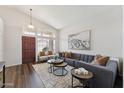 Bright living room with hardwood floors, high ceilings, and stylish modern furniture at 1029 E Jasper Dr, Gilbert, AZ 85296