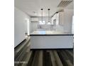 Modern kitchen with marble countertops, white cabinets, stainless steel sink, and stylish backsplash at 1214 E Henry St, Tempe, AZ 85288