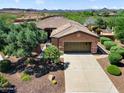 Aerial view of a home with a spacious driveway, desert landscaping, and a two-car garage at 13072 W Alyssa Ln, Peoria, AZ 85383