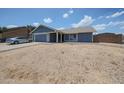 Charming single-Gathering home with blue exterior, well-maintained landscaping, and attached two-car garage at 14412 N 39Th Ave, Phoenix, AZ 85053