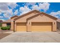 Attached three-car garage offering plenty of parking and storage space for vehicles and equipment at 16609 N 40Th Dr, Phoenix, AZ 85053