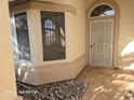 Inviting front entrance with a decorative security door and stone accents at 20641 N 110Th Ave, Peoria, AZ 85373