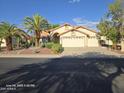 Inviting single-story home with desert landscaping and a spacious driveway at 20641 N 110Th Ave, Peoria, AZ 85373