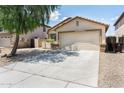 Home featuring a two-car garage, desert landscaping, and wide driveway at 2698 E Denim Trl, San Tan Valley, AZ 85143