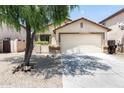 Inviting home featuring desert landscaping, attached two-car garage, and neutral exterior paint at 2698 E Denim Trl, San Tan Valley, AZ 85143