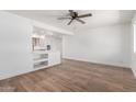 Bright living room featuring stylish wood-look floors, white walls and open concept floorplan at 350 N 88Th St, Mesa, AZ 85207