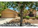 Charming home featuring a desert landscape, stone accents, and a two-car garage with ample parking space at 3715 S Skyline Dr, Gilbert, AZ 85297
