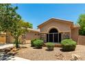 A single-story home with desert landscaping, stone accents, and an arched front window at 3715 S Skyline Dr, Gilbert, AZ 85297