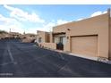 Tan stucco home in a quiet neighborhood with private courtyard and garage at 37222 N Tom Darlington Dr # 15, Carefree, AZ 85377