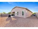 Large backyard features a cozy covered patio, perfect for entertaining or relaxing with minimal maintenance at 3865 E Dogwood Pl, Chandler, AZ 85286