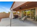Enjoy the covered patio with ample seating and a hot tub, providing an ideal space for relaxation and entertaining at 3865 E Dogwood Pl, Chandler, AZ 85286