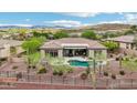 Beautiful single-story home boasts a private pool, mature landscaping, and mountain views at 42429 N Cross Timbers Ct, Anthem, AZ 85086