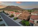 Scenic aerial view of the beautiful neighborhood, showcasing its well-maintained houses and mountain backdrop at 5223 W Bent Tree Dr, Phoenix, AZ 85083