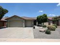 Charming single-Gathering home featuring a three-car garage and meticulously maintained desert landscaping at 5416 W Village Dr, Glendale, AZ 85308