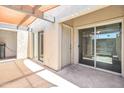 Back patio features sliding doors and a covered area that enhances outdoor living at 620 S Allred Dr, Tempe, AZ 85288