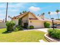 Charming home featuring a well-maintained lawn, mature landscaping, and a two-car garage at 7115 E Buena Terra Way, Paradise Valley, AZ 85253