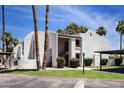 Charming condo building features stucco facade, covered parking, and well-maintained landscaping at 7350 N Via Paseo Del Sur -- # N207, Scottsdale, AZ 85258