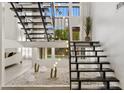 Unique staircase with decorative lighting and modern architectural design at 7409 E Pleasant Run, Scottsdale, AZ 85258
