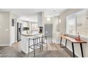 Bright kitchen featuring an island with breakfast bar and modern appliances at 11260 N 92Nd St # 2054, Scottsdale, AZ 85260