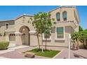 Beautifully landscaped front yard with a young tree and decorative rock at 2920 E Virginia E St, Mesa, AZ 85213