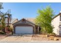 Quaint single-story home with a two-car garage and tidy desert landscaping adding curb appeal at 3755 E Broadway Rd # 36, Mesa, AZ 85206