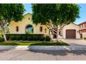 Beautiful home exterior featuring lush landscaping, a manicured lawn, and an inviting facade at 4332 S Oregon Ct, Chandler, AZ 85248