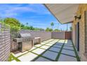 Private outdoor patio features a built in stainless steel gas grill and seating area at 4800 N 68Th St # 101, Scottsdale, AZ 85251